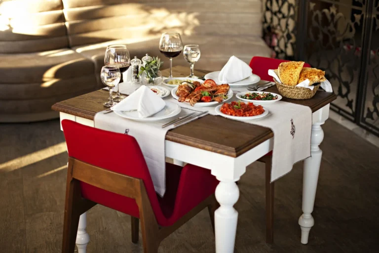 Table set with dishes, glasses and folded napkins