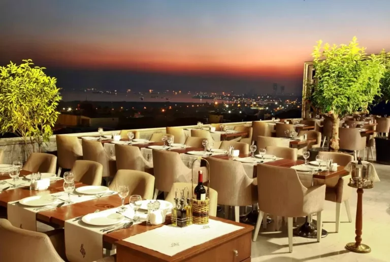 Rooftop dining tables at sunset